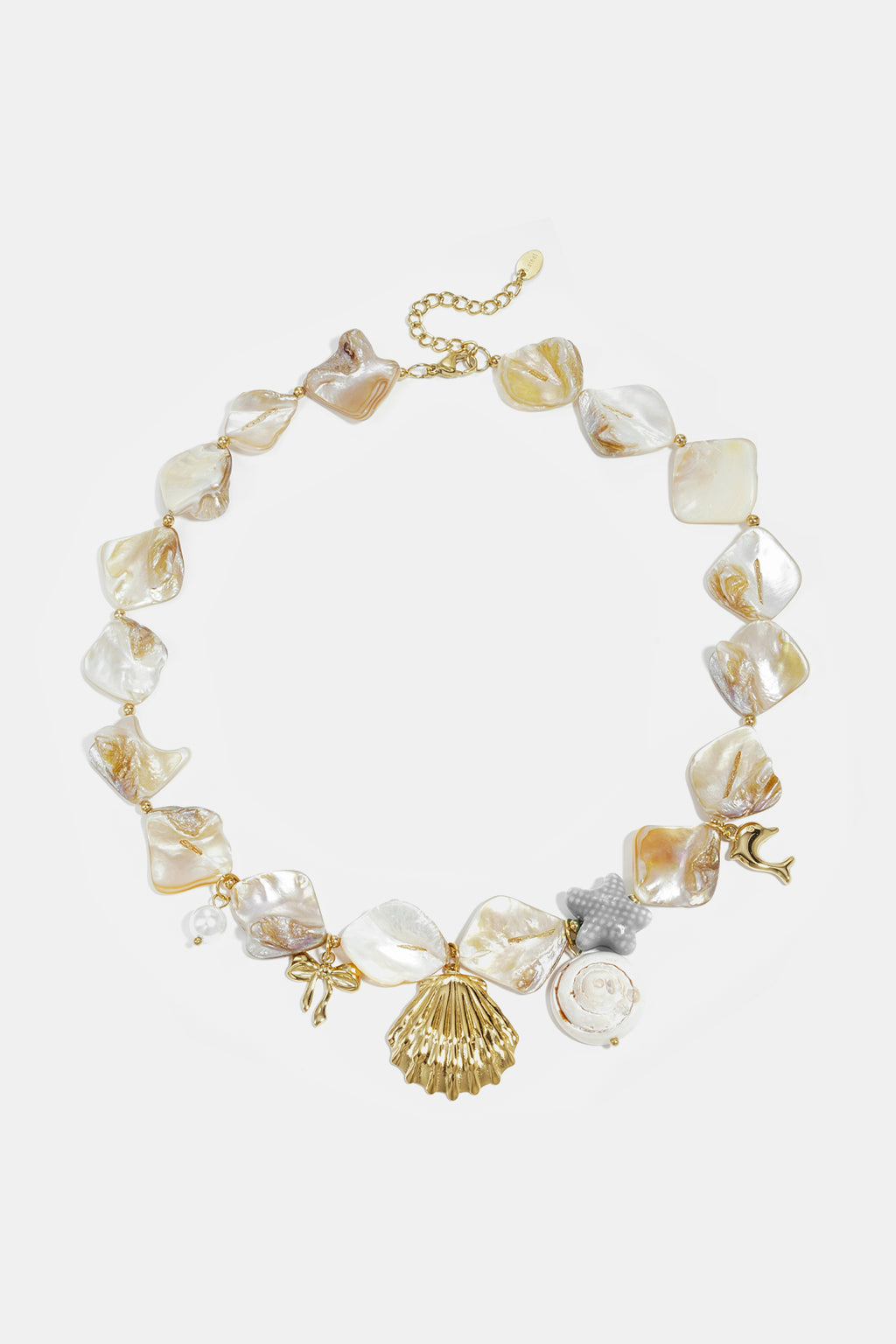 Necklace with beads of seashells, pearls and charms
