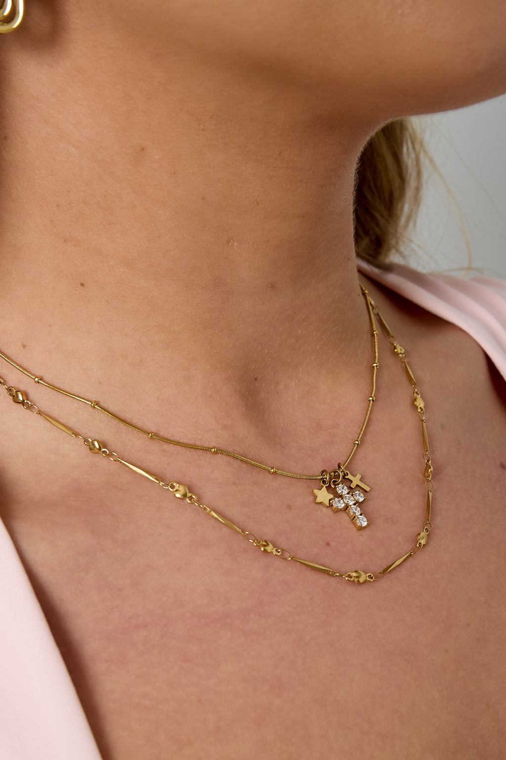 Necklace with cross and star charms
